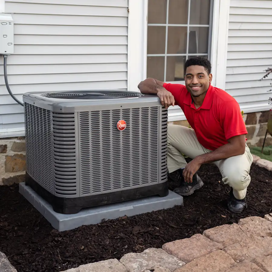 Rheem Pro partner, technician finishing up Rheem Air Conditioner installation at a residential home - residential install - Vandalia, IL